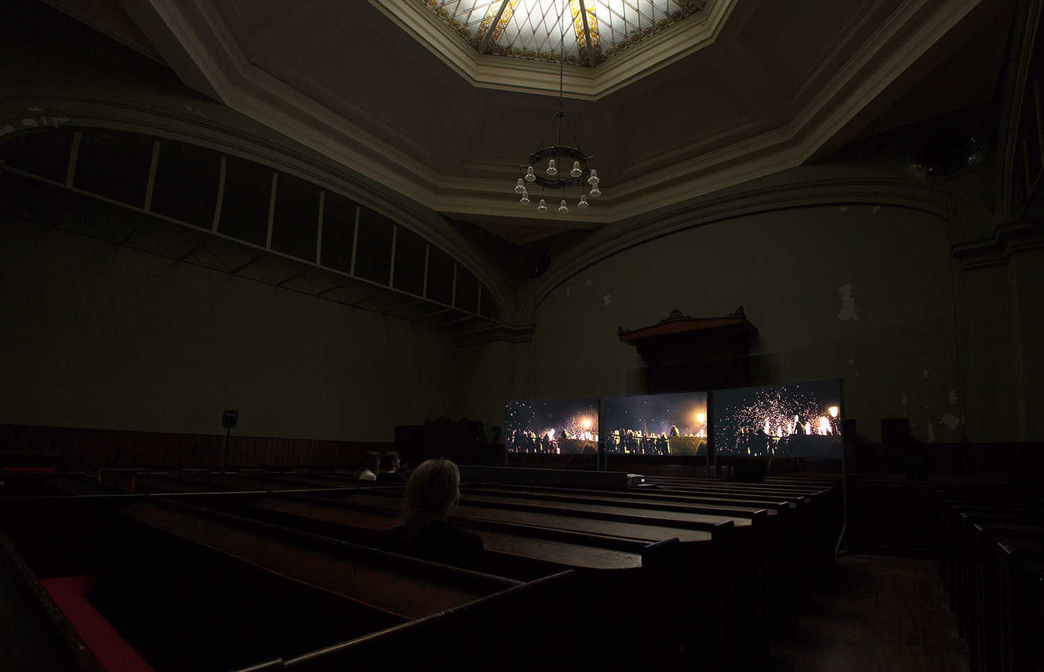 The Clock in Commune, 3 screen video installation in the Glasite House, Edinburgh, fireworks scene